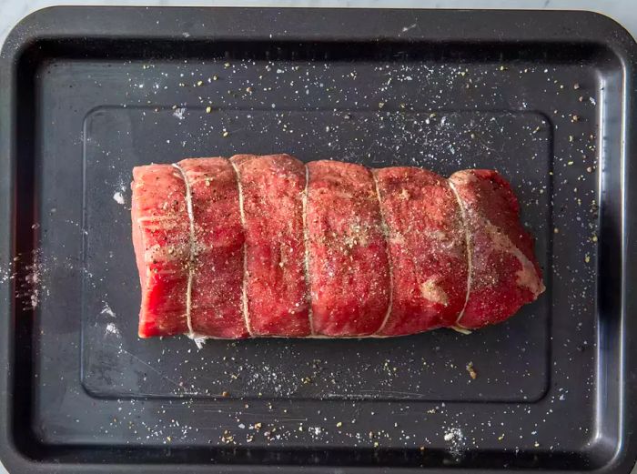 Massage the seasoning mixture evenly onto the roast.