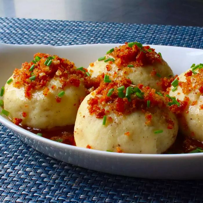 Close-up shot of German Potato Dumplings (Kartoffelkloesse) served in a bowl