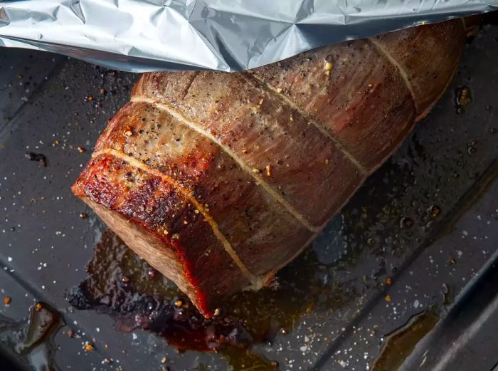 Once the roast is finished cooking, remove it from the oven and place it on a cutting board. Cover it loosely with foil to keep it warm.