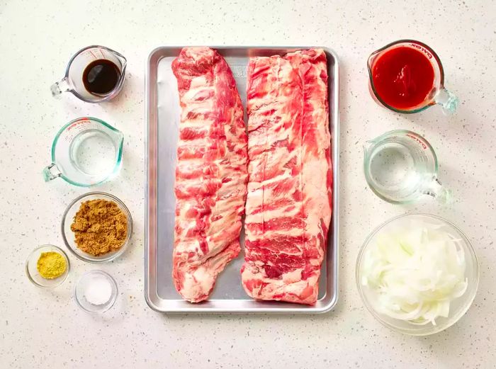 Oven-Baked BBQ Ribs ingredients arranged on the counter