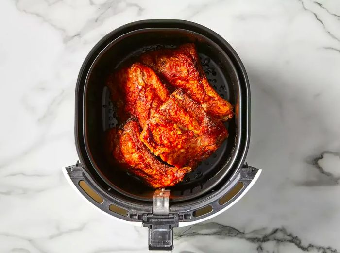 The ribs are fully cooked in the air fryer.