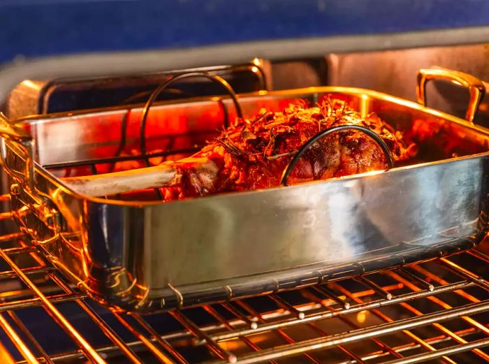 Leg of lamb roasting in the oven.