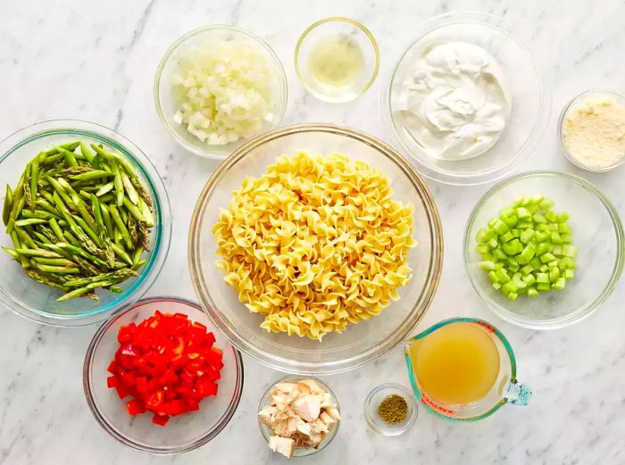 A top-down view showcasing all the ingredients for the Fresh Asparagus and Chicken Casserole