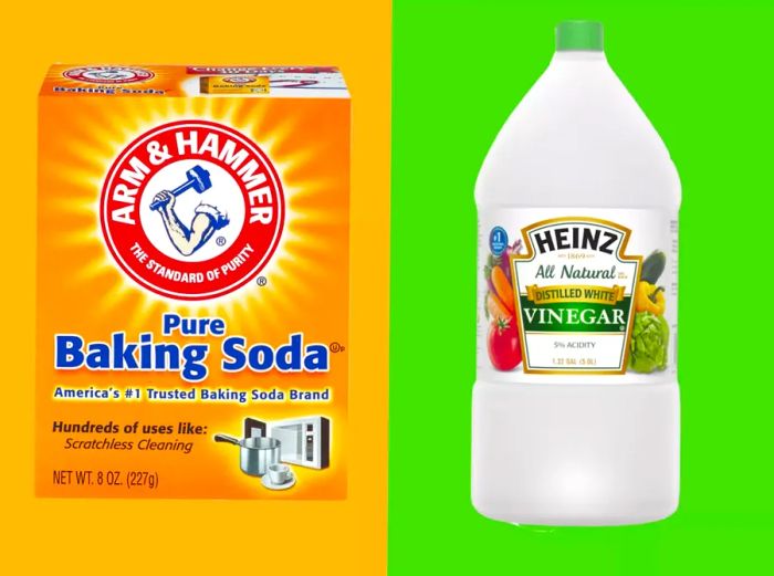 A box of baking soda on an orange background next to a bottle of vinegar on a green background