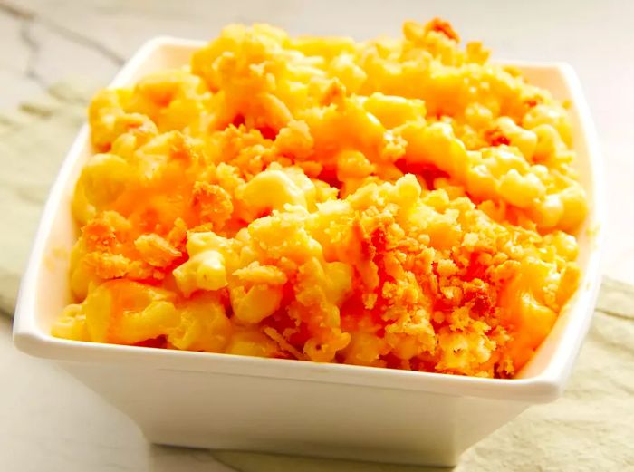 A high-angle shot of baked macaroni and cheese served in a dish, ready to be enjoyed.