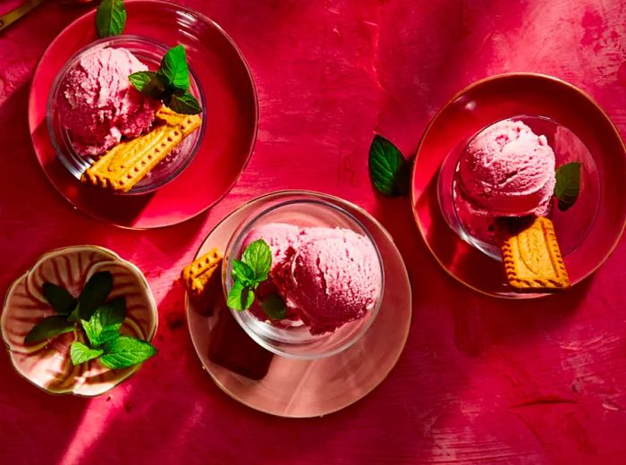 Pomegranate Sherbet in a cup with a cookie