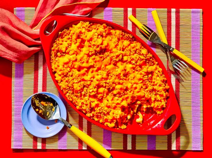 Classic Velveeta Mac and Cheese served in a vibrant red casserole dish