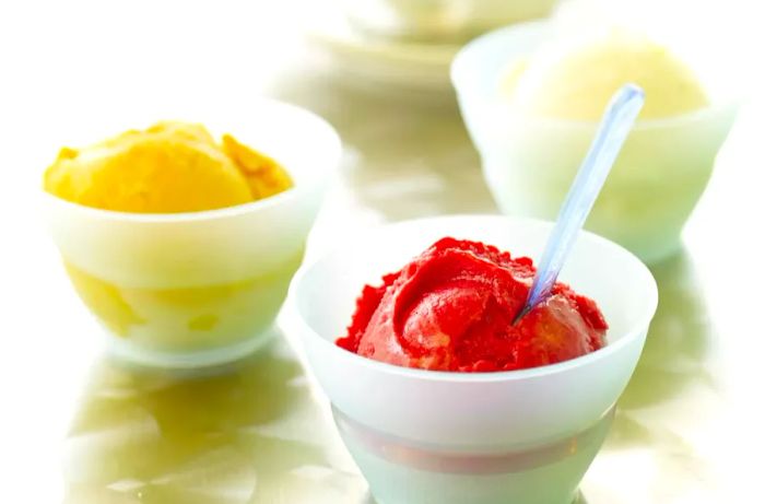 Three bowls of fruit sorbet or sherbet