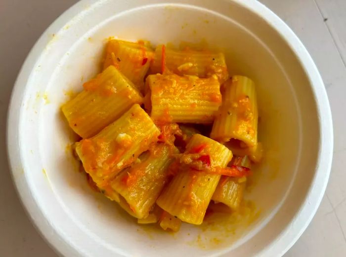 An overhead view of a bowl of Sun Gold tomato pasta