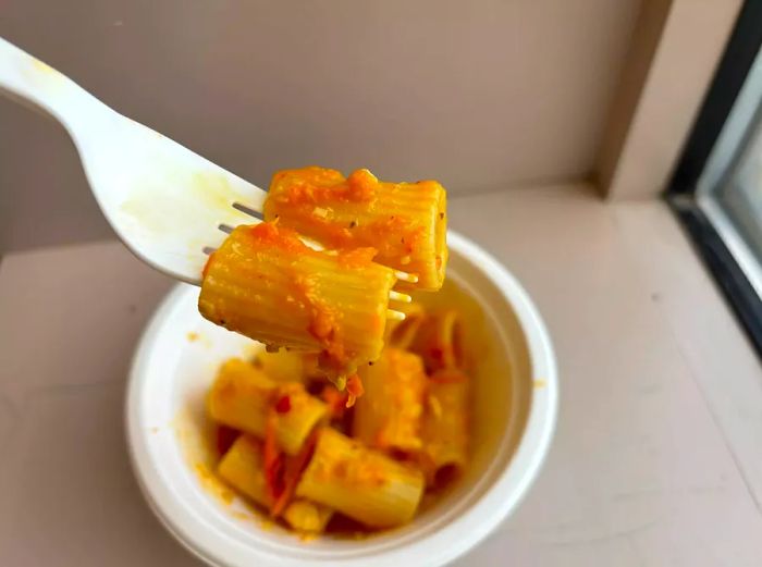 A close-up of Sun Gold tomato pasta on a fork