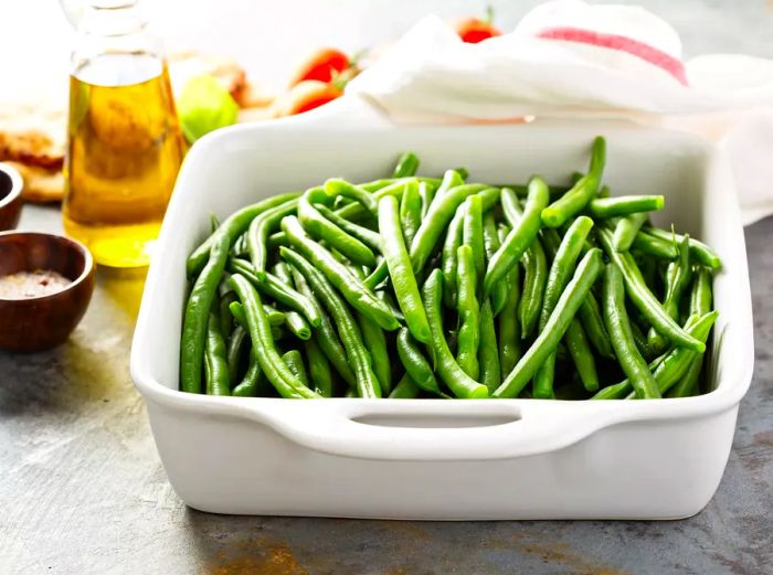 A dish of blanched green beans in a casserole dish