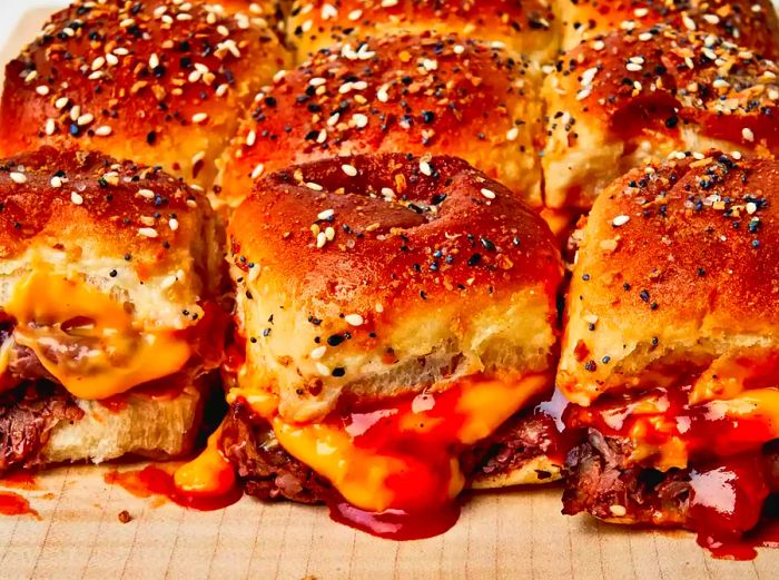golden-brown, toasty roast beef and cheddar sliders topped with BBQ sauce and a sprinkle of bagel seasoning
