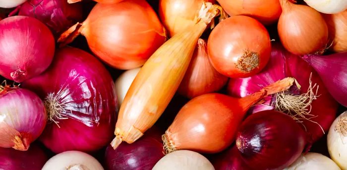 Top view of fresh, vibrant onions as a backdrop