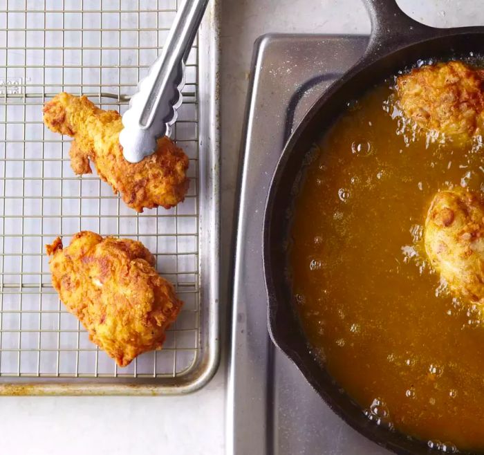 Fried chicken: From oil to rack with tongs