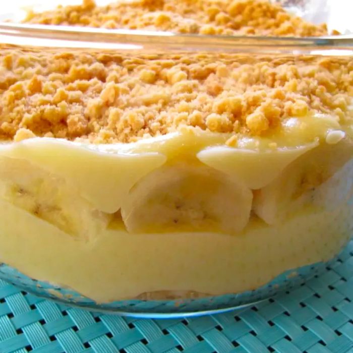 A large glass bowl filled with banana pudding