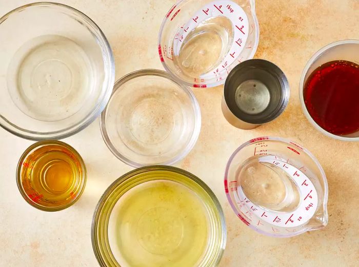 All ingredients are ready for preparing a Long Island Iced Tea.