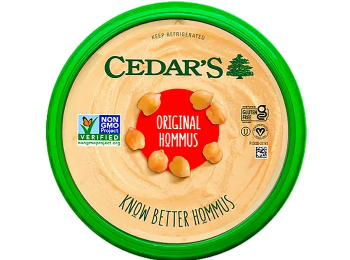 An overhead view of a Cedar's Hommus container