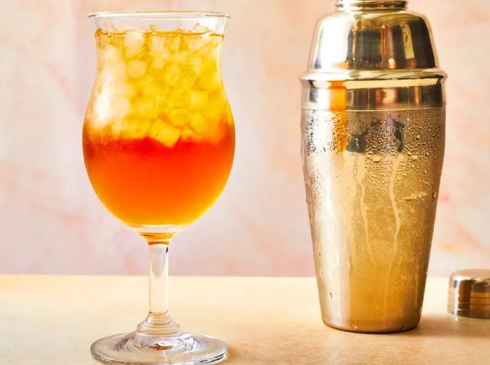 A Long Island Iced Tea served in a hurricane glass.