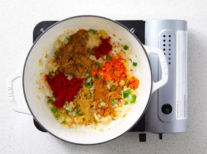 Onion mixture seasoned with cumin, paprika, coriander, garam masala, turmeric, and cayenne pepper.