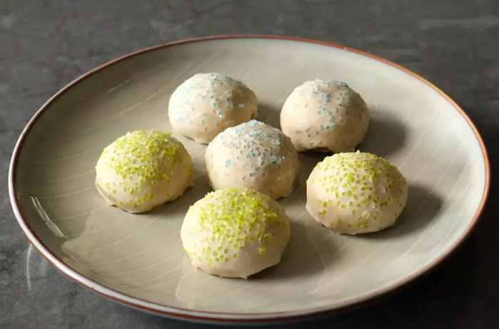 Iced cookies arranged on a white plate