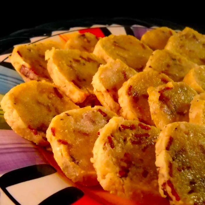 A close-up view of a plate filled with bacon cookies