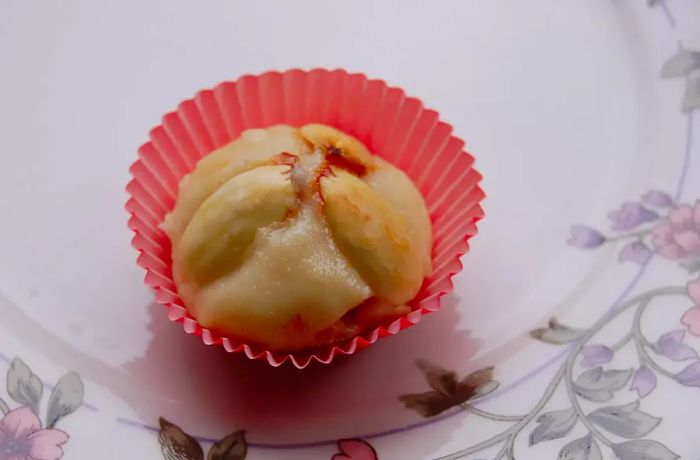 Marzipan cookie placed in a cupcake liner