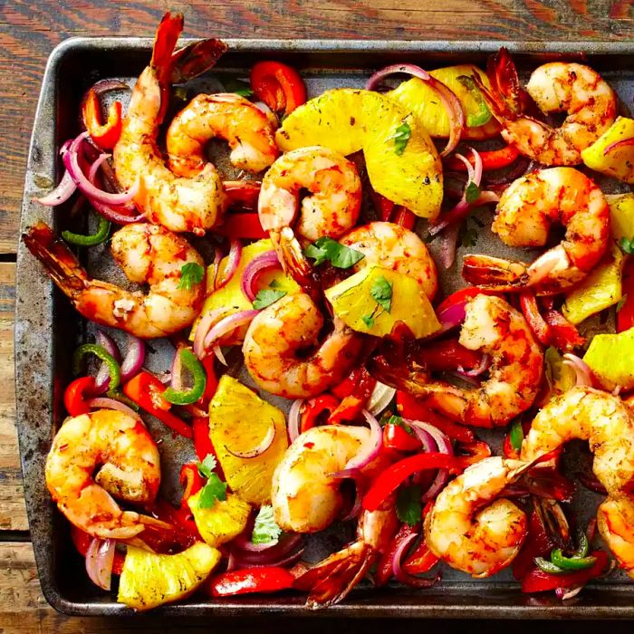 shrimp, pineapple, onions, and peppers roasted on a sheet pan