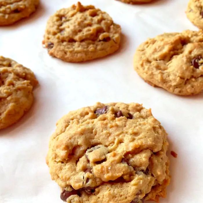 Outrageous Chocolate Chip Cookies on a sheet of white parchment paper