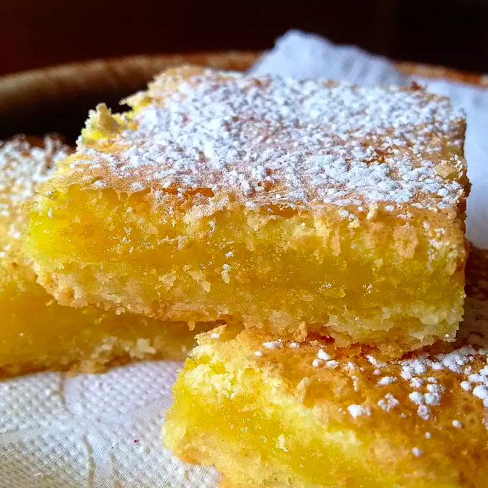 Chef John's Lemon Bars dusted with confectioners' sugar