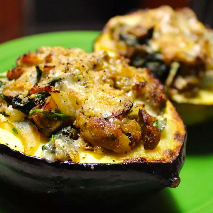 two halves of stuffed acorn squash