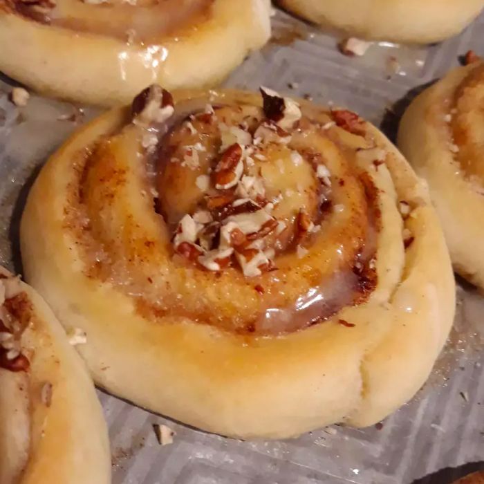 Grandma Bonnie's Cinnamon Rolls resting on a baking sheet