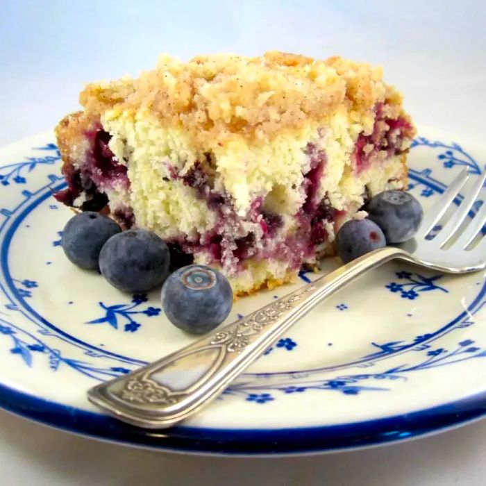 blueberry buckle served on a white and blue plate