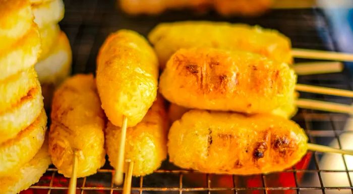 Khao jee: Sticky rice coated with egg and grilled to perfection over a charcoal stove.