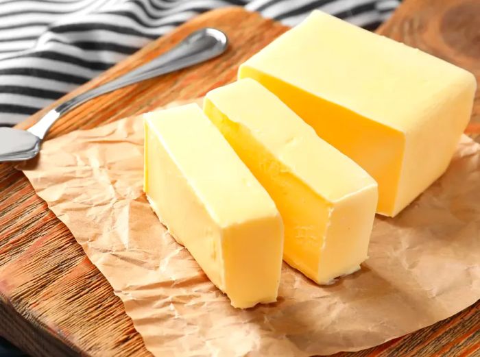 Butter blocks on a rustic wooden board