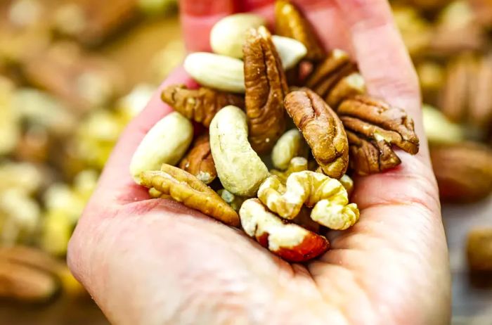 Woman holding a handful of fresh nuts