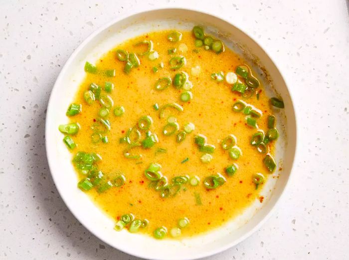 Marinade ingredients combined in a large bowl.