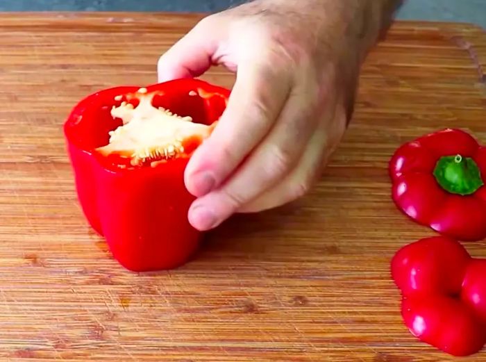 Chef John slicing a bell pepper by hand.