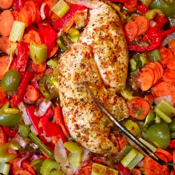 Overhead shot of Baked Chicken Breasts with Vegetables on a baking tray