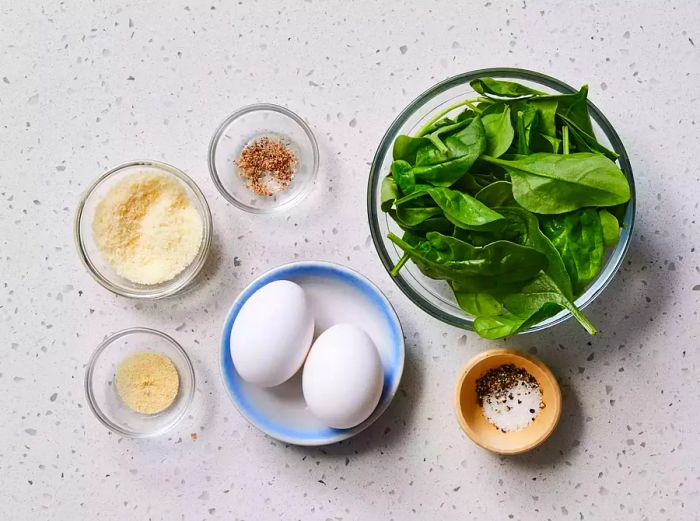 Ingredients for preparing a baby spinach omelet