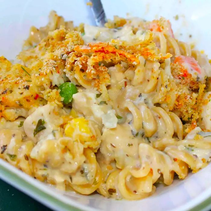 Close-up shot of Chicken and Pasta Casserole with Mixed Vegetables served in a white bowl.