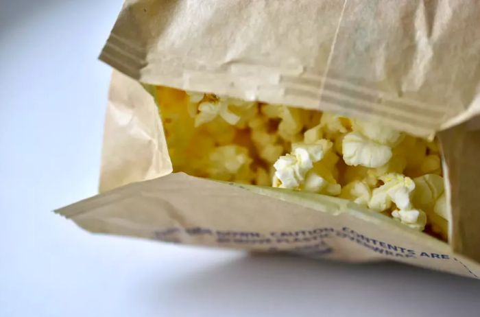 A bag of microwave popcorn on a clean white background.