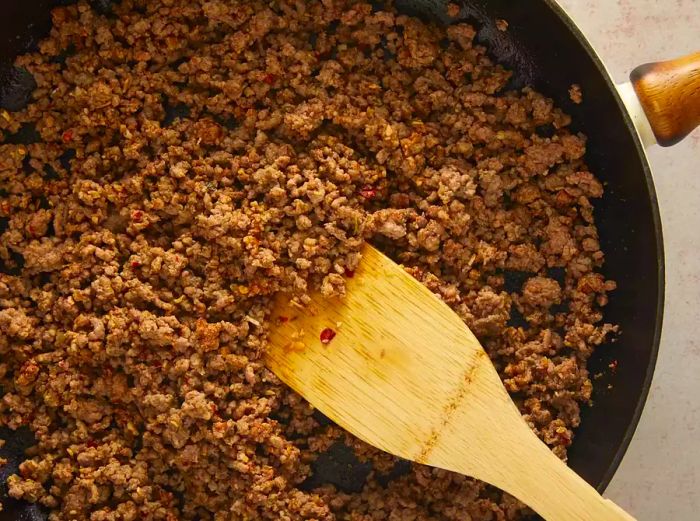 ground beef cooking in a pan