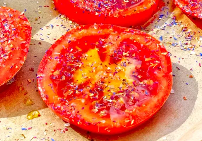 Tomatoes arranged on parchment paper