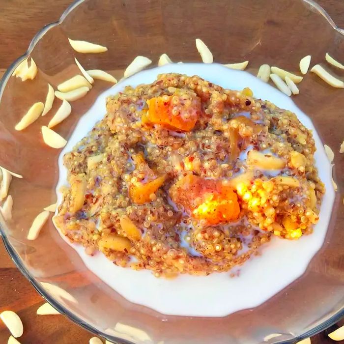 Quinoa Breakfast Porridge served in a glass bowl