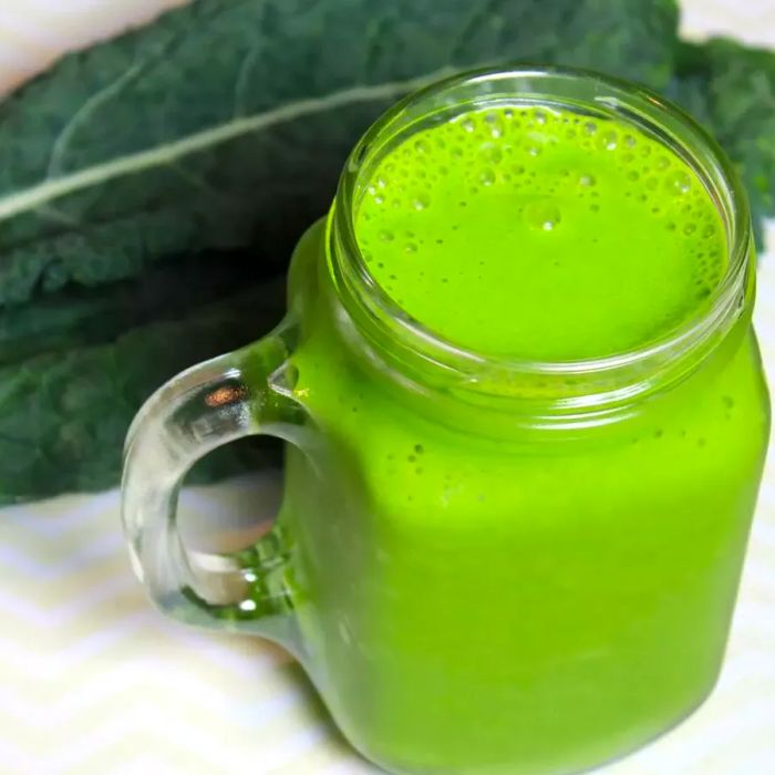 green smoothie served in a glass mug