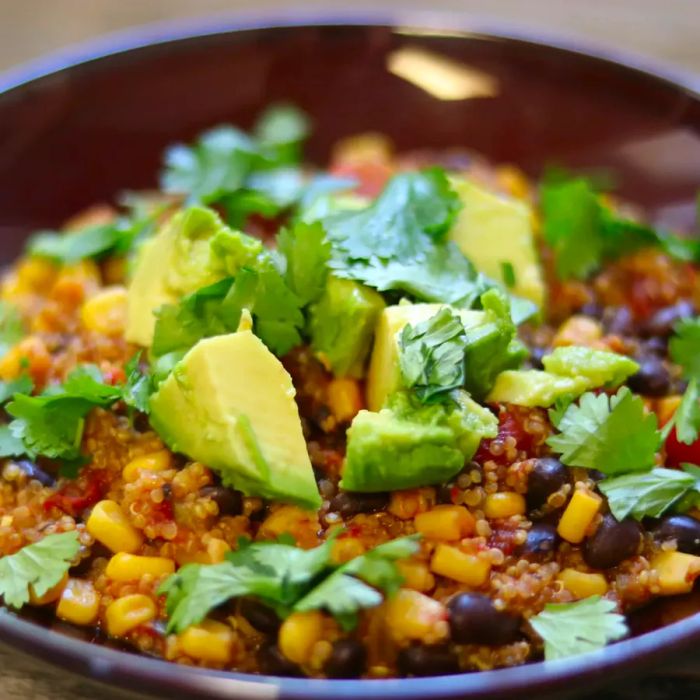 quinoa and corn topped with creamy avocado and fresh cilantro