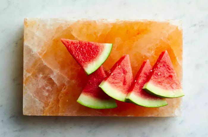 Watermelon slices on a marble surface