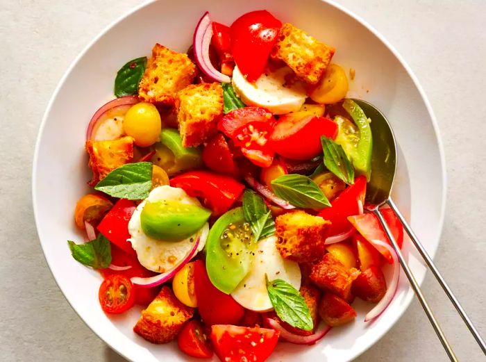 Focaccia panzanella served in a simple white bowl