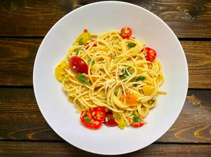 Ina Garten's Summer Garden Pasta served on a pristine white plate.