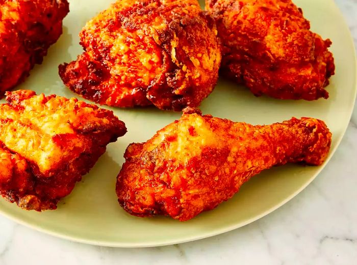 overhead shot of a plate filled with golden, crispy fried chicken